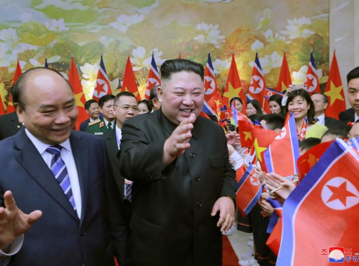 North Korean leader Kim Jong Un and Vietnam's Prime Minister Nguyen Xuan Phuc are welcomed by people in Hanoi, Vietnam March 1, 2019 in this photo released by North Korea's Korean Central News Agency (KCNA) on March 2, 2019. KCNA via REUTERS ATTENTION EDI