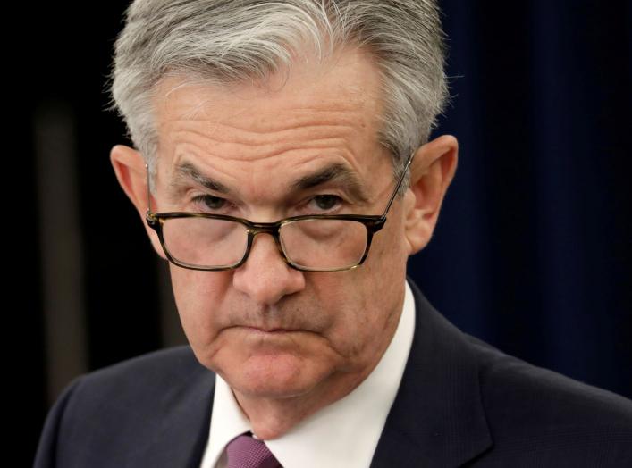FILE PHOTO: Federal Reserve Board Chairman Jerome Powell listens to questions at his news conference following the closed two-day Federal Open Market Committee meeting in Washington, U.S., May 1, 2019. REUTERS/Yuri Gripas/File Photo
