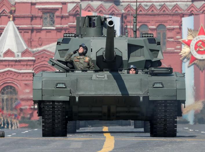 Russian servicemen drive a T-14 tank with the Armata universal combat platform during a rehearsal for the Victory Day parade, which marks the anniversary of the victory over Nazi Germany in World War Two, in Red Square in central Moscow, Russia May 7, 201