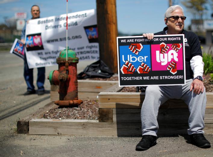 Uber and Lyft drivers protest during a day-long strike outside Uber’s office in Saugus, Massachusetts, U.S., May 8, 2019. REUTERS/Brian Snyder