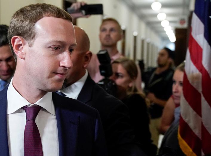 Facebook Chief Executive Mark Zuckerberg walks past members of the news media as he enters the office of U.S. Senator Josh Hawley (R-MO) while meeting with lawmakers to discuss "future internet regulation on Capitol Hill in Washington, U.S., September 19