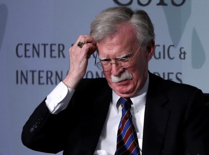 White House former National Security Advisor John Bolton fixes his hair and listens to a question after his remarks on North Korea at the Center for Strategic and International Studies (CSIS) think tank in Washington, U.S. September 30, 2019.