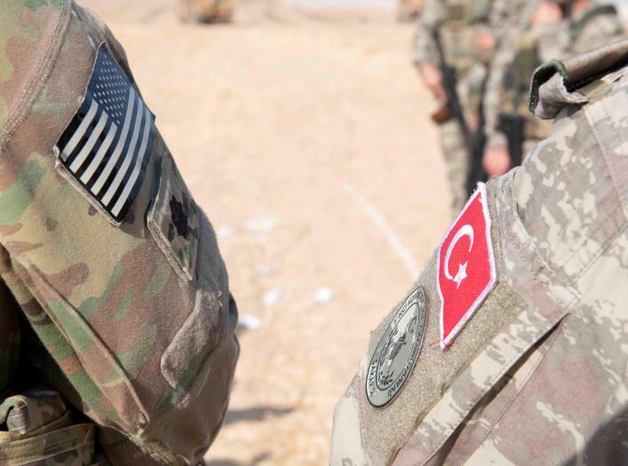 U.S. and Turkish military forces conduct a joint ground patrol inside the security mechanism area in northeast, Syria, October 4, 2019. Picture taken October 4, 2019. U.S. Army/Staff Sgt. Andrew Goedl/Handout via REUTERS.
