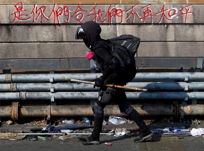 A protester walks at the occupied campus of the Chinese University in Hong Kong, China, November 13, 2019. REUTERS/Thomas Peter
