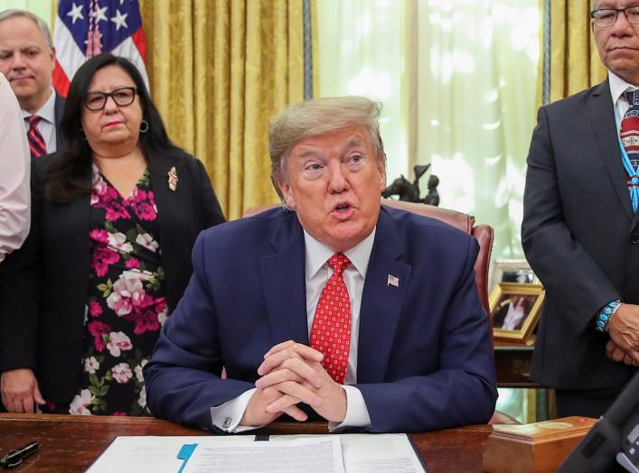 U.S. President Donald Trump speaks while signing an Executive Order "Establishing the Task Force on Missing and Murdered American Indians and Alaska Natives" in the Oval Office of the White House in Washington, U.S., November 26, 2019. REUTERS/Jonathan Er