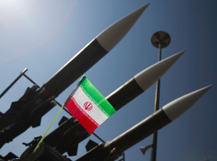 An Iranian flag is pictured next to Russian-made Sam-6 surface-to-air missiles during a war exhibition held by Iran's revolutionary guard to mark the anniversary of the Iran-Iraq war (1980-88), also known in Iran as the "Holy Defence", at Baharestan squar