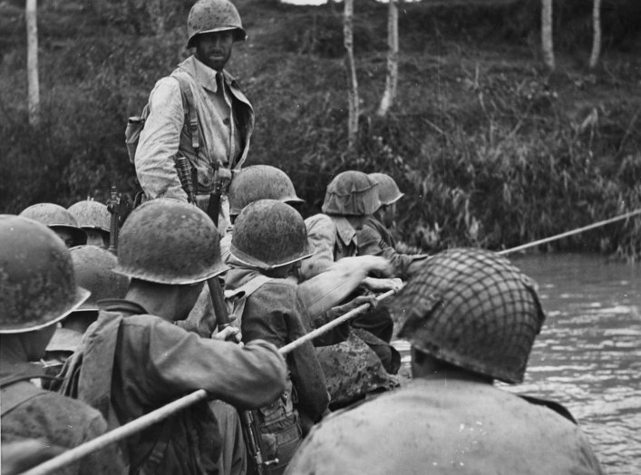 U.S. troops prepare to cross the Voltuma on board a rubber dinghy. Wikimedia.