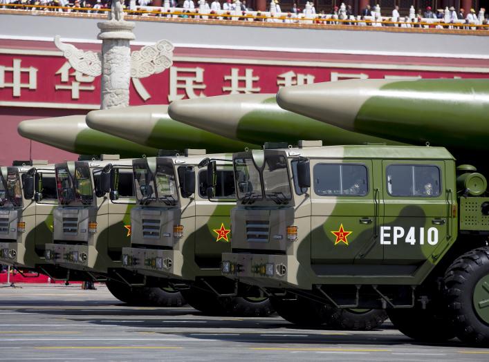 Military vehicles carrying DF-26 ballistic missiles travel past Tiananmen Gate during a military parade to commemorate the 70th anniversary of the end of World War II in Beijing Thursday Sept. 3, 2015. 