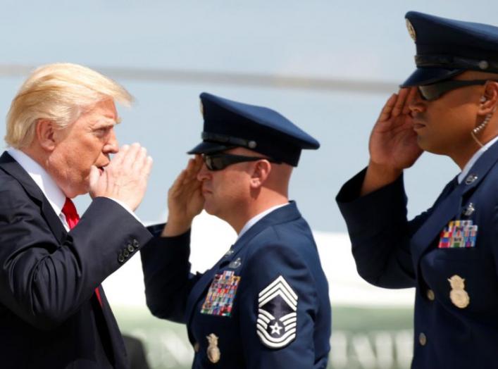 U.S. President Donald Trump returns a salute while boarding Air Force One as he departs Joint Base Andrews in Maryland, U.S., August 30, 2017. REUTERS/Kevin Lamarque