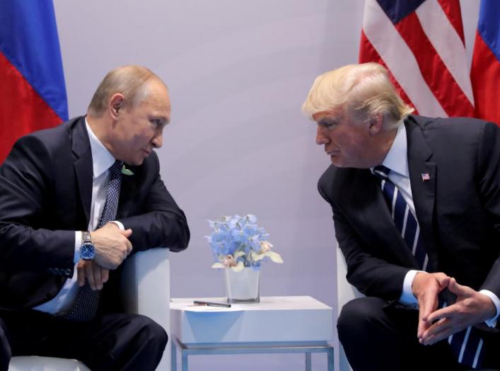 Russia's President Vladimir Putin talks to U.S. President Donald Trump during their bilateral meeting at the G20 summit in Hamburg, Germany, July 7, 2017. REUTERS/Carlos Barria//File Photo