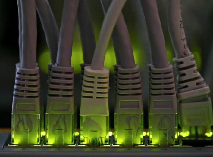 LAN network cables plugged into a Bitcoin mining computer server are pictured in Bitminer Factory in Florence, Italy, April 6, 2018. Picture taken April 6, 2018. REUTERS/Alessandro Bianchi