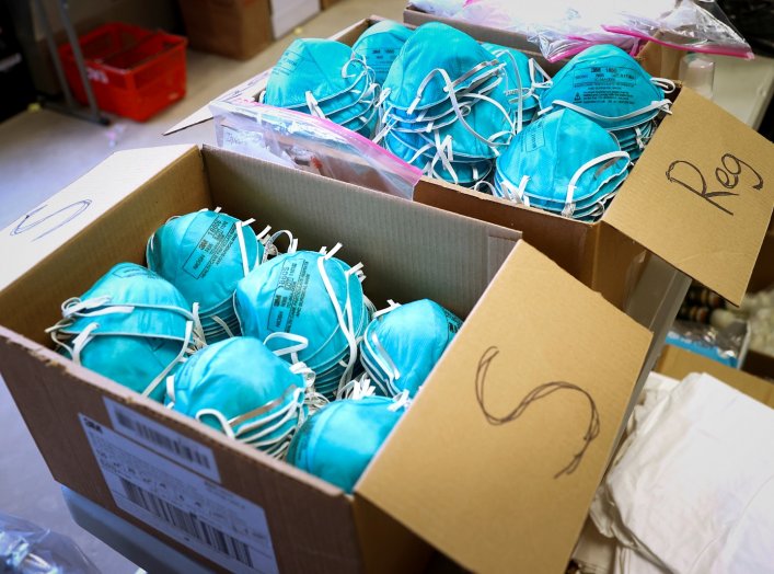 FILE PHOTO: Boxes of N95 protective masks for use by medical field personnel are seen at a New York State emergency operations incident command center during the coronavirus outbreak in New Rochelle, New York, U.S., March 17, 2020. REUTERS/Mike Segar/File