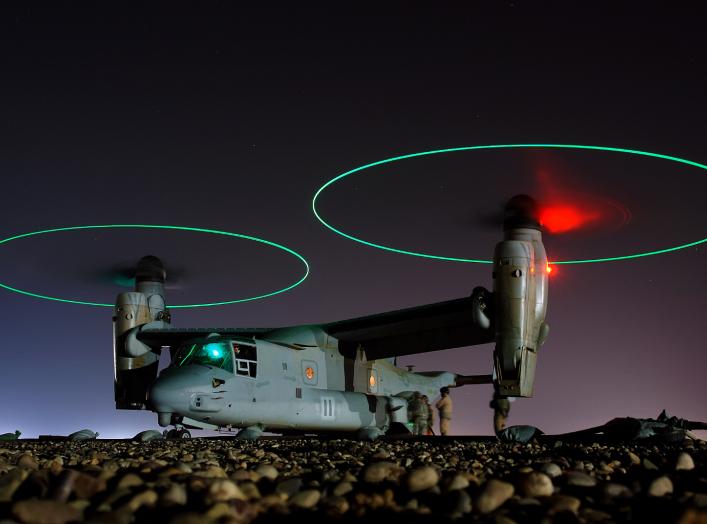 Crew members refuel an MV-22 before a night mission in Iraq, 2008