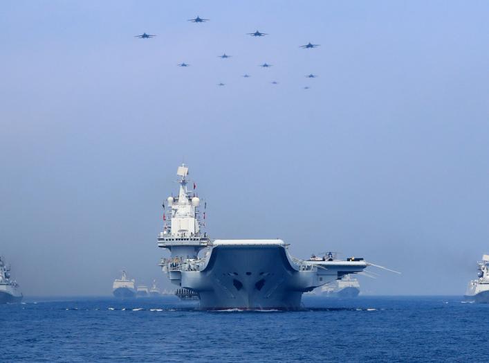 Warships and fighter jets of Chinese People's Liberation Army (PLA) Navy take part in a military display in the South China Sea April 12, 2018. Picture taken April 12, 2018. REUTERS/Stringer 