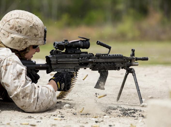  Marine with Alpha Company, 8th Engineer Support Battalion, 2nd Marine Logistics Group fires an M-249 Squad Automatic Weapon during a machine gun shoot aboard Camp Lejeune, N.C., April 14, 2014.