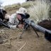 U.S. Marines attached to Scout Sniper Platoon, Weapons Company, 1st Battalion, 3rd Marine Regiment, "The Lava Dogs" pose as a Sniper Spotter team with the M107 .50-caliber Sniper Rifle at Lava Viper aboard Pohakuloa Training Area, Hawaii, June 3, 2015.(U.