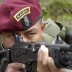 A Kaibil shows the proper way to fire a Galil assault rifle during an exhibition in the Special Forces Brigade, known as "Kaibil's Hell", in Poptun, Peten, October 30, 2006. REUTERS/Carlos Duarte