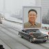  Image: A limousine carrying a portrait of late North Korean leader Kim Jong-il leads his funeral procession in Pyongyang in this photo taken by Kyodo December 28, 2011. REUTERS/Kyodo.