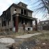 A partially burned, abandoned house is seen in Detroit, Michigan, January 7, 2012. REUTERS/Rebecca Cook.