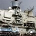 Naval personnel stand in front of the Russian aircraft carrier Kuznetsov in the Syrian city of Tartous on the Mediterranean sea January 8, 2012, in this handout photograph released by Syria's national news agency SANA. QUALITY FROM SOURCE. REUTERS/SANA/Ha
