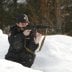 Special task force police officer Irina Samit, who is also an instructor, aims with a Kalashnikov AK-47 rifle as she takes part in a training session in the suburbs of Russia's Siberian city of Krasnoyarsk, March 6, 2014. REUTERS/Ilya Naymushin