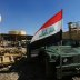 An Iraqi flag is seen on a military vehicle at an oil field in Dibis area on the outskirts of Kirkuk, Iraq October 17, 2017. REUTERS/Alaa Al-Marjani