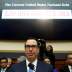 Treasury Secretary Steven Mnuchin sits under a display of the U.S. national debt as he testifies to the House Financial Services Committee on "The Annual Report of the Financial Stability Oversight Council" on Capitol Hill in Washington, U.S., February 6,