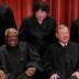 U.S. Supreme Court Associate Justice Sonia Sotomayor makes Associate Justice Clarence Thomas and Chief Justice John Roberts laugh as they pose together for their group portrait at the Supreme Court in Washington, U.S., November 30, 2018. REUTERS/Jim Young