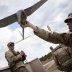 New York Army National Guard Corporal Matthew G. Mena performs a systems check on an RQ-11 Raven B, a small unmanned aerial system or drone, during the field training at Joint Base McGuire-Dix-Lakehurst, New Jersey, U.S. May 15, 2019. New Jersey National 