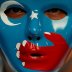 A Chinese Uyghur Muslim participates in an anti-China protest during the G20 leaders summit in Osaka, Japan June 28, 2019. REUTERS/Jorge Silva