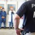 Image: Homeland Security Investigations (HSI) officers from Immigration and Customs Enforcement (ICE) look on after executing search warrants and making some arrests at an agricultural processing facility in Canton, Mississippi, U.S. in this August 7, 201