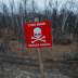 A landmine warning sign is seen near the contact line between Ukrainian troops and pro-Moscow rebels in the settlement of Stanytsia Luhanska, Ukraine November 20, 2019. REUTERS/Gleb Garanich
