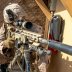 A U.S. Marine with 2nd Battalion, 7th Marines, assigned to the Special Purpose Marine Air-Ground Task Force-Crisis Response-Central Command (SPMAGTF-CR-CC) 19.2, looks through the scope of a M110 Semi-Automatic Sniper System (SASS) at the U.S. embassy com