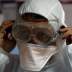 A member of the medical staff puts on protective gear at a new section specialised in receiving any person who may have been infected with coronavirus, at the Al-Bashir Governmental Hospital in Amman, Jordan January 28, 2020.REUTERS/Muhammad Hamed