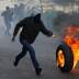 A Palestinian demonstrator rolls a burning tire during a protest against the U.S. President Donald Trump’s Middle East peace plan, in Hebron in the Israeli-occupied West Bank January 31, 2020. REUTERS/Mussa Qawasma