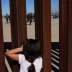 A child looks at U.S. Border Patrol agents conducting a training exercise at the border fence between Ciudad Juarez, Mexico and Sunland Park, U.S., as seen from Ciudad Juarez, Mexico January 31, 2020. REUTERS/Jose Luis Gonzalez