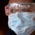 FILE PHOTO: A passenger wearing a mask walk outside the Shanghai railway station in Shanghai, China, as the country is hit by an outbreak of a new coronavirus, February 4, 2020. REUTERS/Aly Song/File Photo