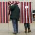 A voter enters a voting booth to fill out a ballot to vote in New Hampshire's first-in-the-nation U.S. presidential primary election at the Stark volunteer fire dept. in Stark, New Hampshire, U.S., February 11, 2020. REUTERS/Brendan McDermid