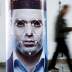 A man walks past a poster simulating facial recognition software at the Security China 2018 exhibition on public safety and security in Beijing, China October 24, 2018. REUTERS/Thomas Peter