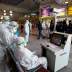 Medical staff in protective gear look at a screen while checking temperatures of passengers upon their arrival, following an outbreak of the coronavirus, at Najaf airport, in the holy city of Najaf, Iraq February 26, 2020. Picture taken February 26, 2020.
