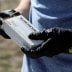 Firearms instructor Joseph Wilkey wears gloves while holding a box of 9mm Winchester ammunition during a firearms safety class conducted by Level Up Firearms amid fears of the global growth of coronavirus disease (COVID-19) cases, outside Loveland, Colora