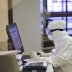 A medical staff member wearing a protective suit works at the special unit of the Sklifosovsky Research Institute of Emergency Medicine for the patients who are suspected to have contracted COVID-19, caused by the coronavirus, in Moscow, Russia March 25