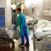 A staff moves a patient during a media visit of the Swiss Army deployment at Pourtales Hospital during the coronavirus disease (COVID-19) outbreak in Neuchatel, Switzerland, March 25, 2020. REUTERS/Denis Balibouse