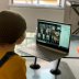 A school kid socializes with peers online following school closures due the spread of the coronavirus disease (COVID-19) outbreak, in London, Britain, March 20, 2020 in this picture obtained from social media on March 25, 2020. Anais Aguerre/via REUTERS