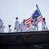 Sailors man the rails as the USS Ronald Reagan, a Nimitz-class nuclear-powered super carrier, departs for Yokosuka, Japan from Naval Station North Island in San Diego, California August 31, 2015. REUTERS/Mike Blake