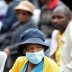 An elderly women looks on as she queues for government grants despite coronavirus risks during a 21 day nationwide lockdown, aimed at limiting the spread of coronavirus disease (COVID-19), in Soweto, South Africa, March 30, 2020. REUTERS/Siphiwe Sibeko
