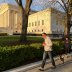 A family walk their dog past the U.S. Supreme Court building at sunset during the outbreak of the coronavirus disease (COVID-19), as personal exercise is exempted from the city-wide stay at home orders in Washington, U.S. April 3, 2020. REUTERS/Jonathan E