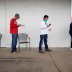 People who lost their jobs wait in line to file for unemployment following an outbreak of the coronavirus disease (COVID-19), at an Arkansas Workforce Center in Fayetteville, Arkansas, U.S. April 6, 2020. REUTERS/Nick Oxford