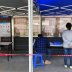 Residents fill out registration data ahead of coronavirus checks outside a local hospital in Guangzhou's Sanyuanli area, as the spread of the novel coronavirus disease (COVID-19) continues in the country, in Guangdong province, China April 13, 2020. REUTE