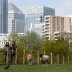 People wearing protective face masks are seen at Mudchute Park and Farm near the Canary Wharf financial district, as the spread of the coronavirus disease (COVID-19) continues, London, Britain, April 13, 2020. REUTERS/John Sibley